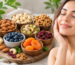 Healthy skin with a variety of dry fruits including almonds, walnuts, pistachios, cashews, dried apricots, cranberries, and blueberries rich in skin-nourishing nutrients.